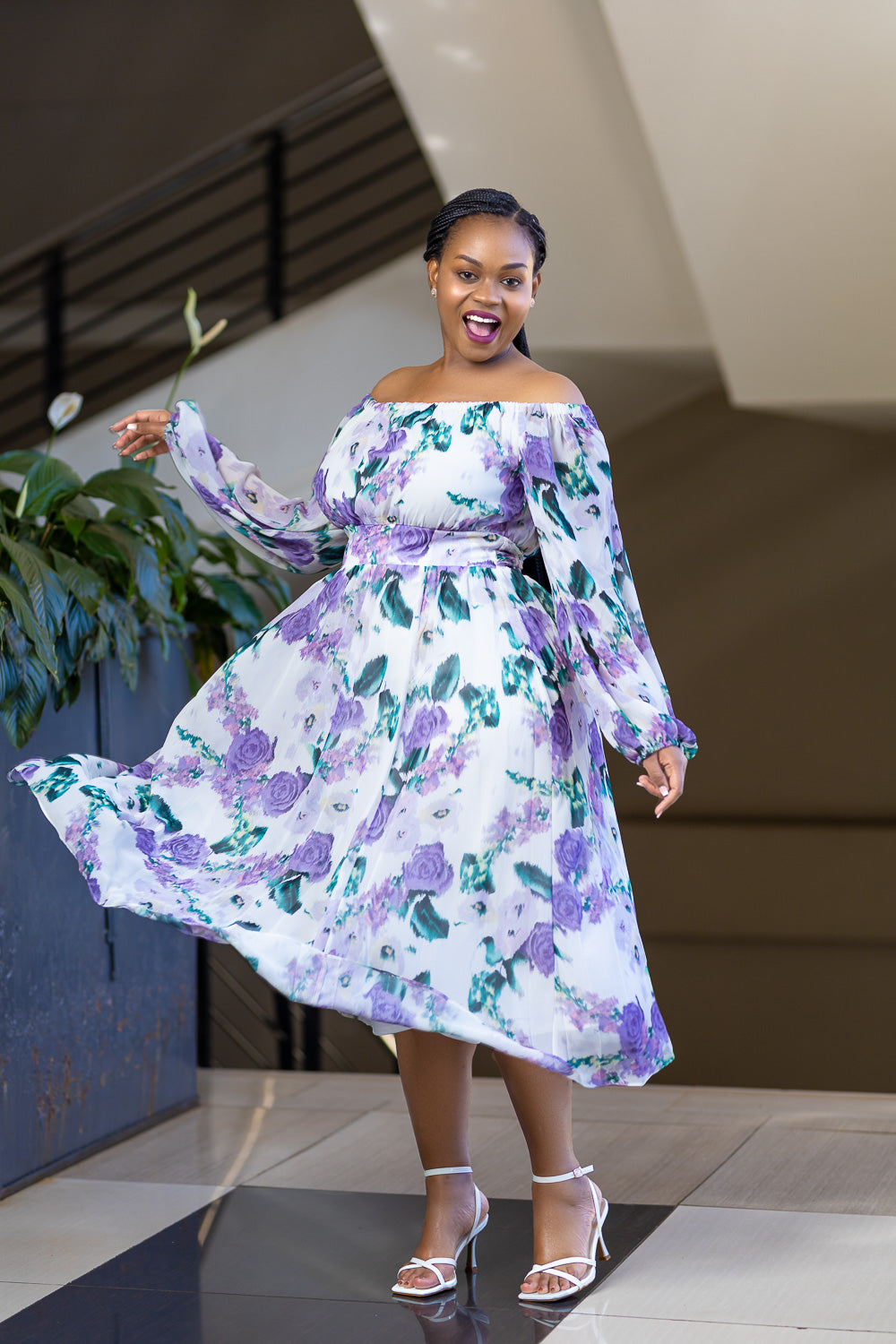 Lilac off shoulder dress with floral pattern.