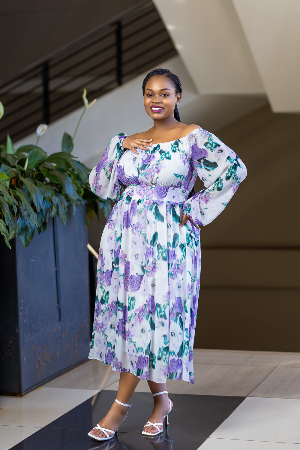 Lilac off shoulder dress with floral pattern.