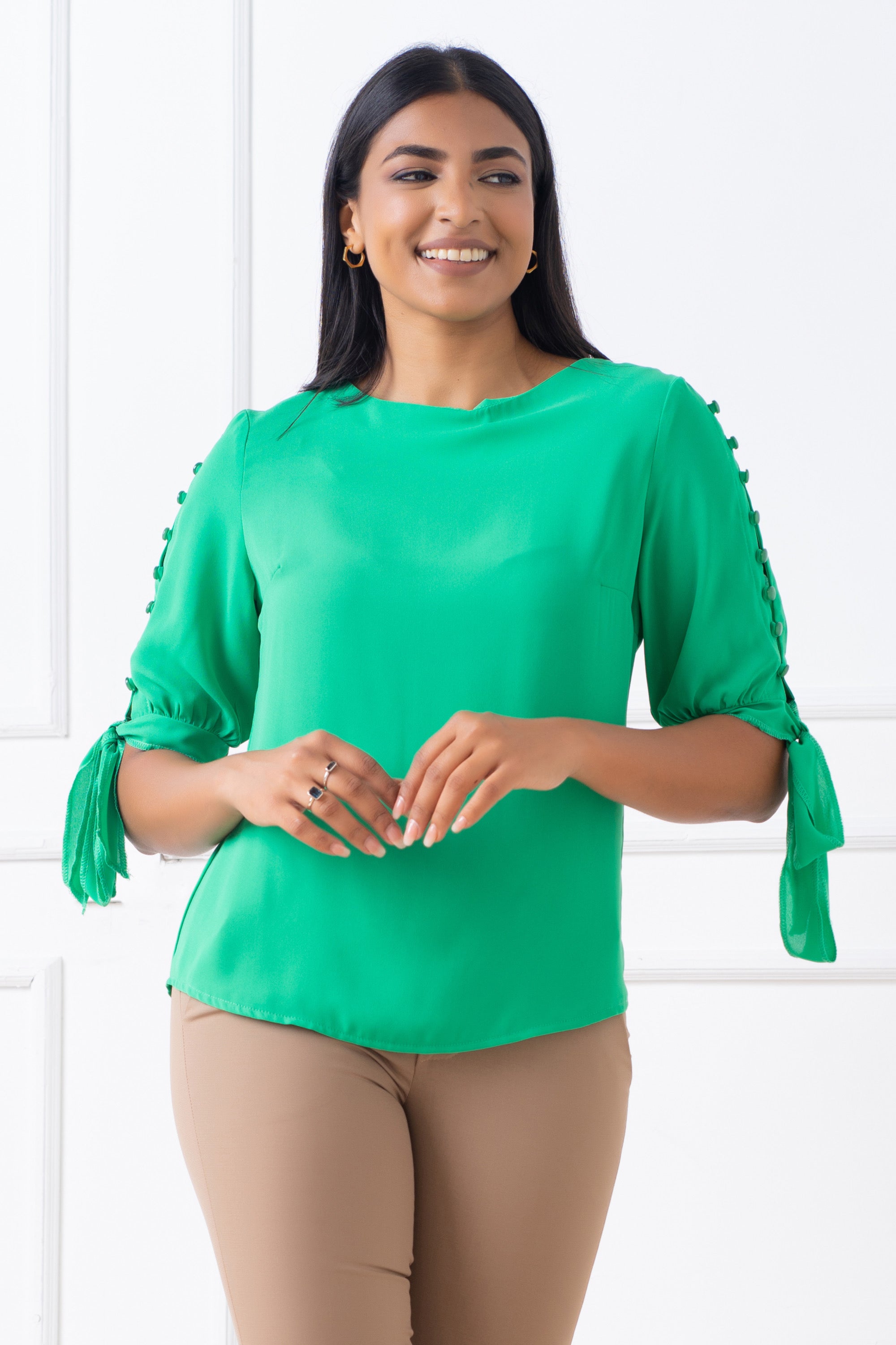 Top with sleeve button detailing. Regular fit.